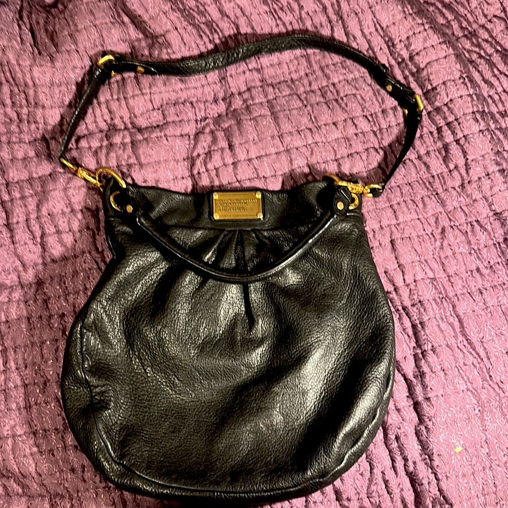 Marc Jacobs black Hobo Bag, it does have a very faint scratch- see last photo